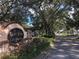 Lake View on Lake Fredrica entrance sign surrounded by lush landscaping and mature trees at 2597 Oak Park Way # 205, Orlando, FL 32822