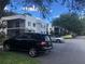 Apartment complex featuring on-site parking and exterior facade at 2597 Oak Park Way # 205, Orlando, FL 32822