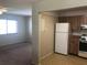 Kitchen with wooden cabinets and white appliances at 2597 Oak Park Way # 205, Orlando, FL 32822
