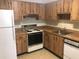 Kitchen with wood cabinets, oven, and laminate countertop at 2597 Oak Park Way # 205, Orlando, FL 32822