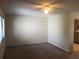 Living room with neutral walls, cozy carpeting, and an abundance of natural light at 2597 Oak Park Way # 205, Orlando, FL 32822