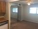 Inviting living room featuring neutral walls, carpet floors, a ceiling fan and a mirrored wall at 2597 Oak Park Way # 205, Orlando, FL 32822