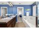 A bathroom features a soaking tub and double sinks at 2817 Noble Crow Dr, Kissimmee, FL 34744