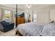 Bedroom with a view, featuring a four-poster bed and ample natural light at 2817 Noble Crow Dr, Kissimmee, FL 34744