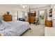 Bright bedroom with a four-poster bed, large windows, and neutral decor at 2817 Noble Crow Dr, Kissimmee, FL 34744