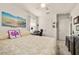A bright bedroom featuring a ceiling fan, natural light, and a comfortable bed at 2817 Noble Crow Dr, Kissimmee, FL 34744