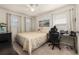 A cozy bedroom featuring a ceiling fan, natural light, and a comfortable bed at 2817 Noble Crow Dr, Kissimmee, FL 34744