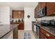 Kitchen featuring stainless steel appliances, granite countertops, and plentiful cabinetry at 2817 Noble Crow Dr, Kissimmee, FL 34744