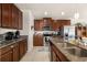 Well-equipped kitchen with stainless steel appliances, granite countertops, and plenty of cabinet space at 2817 Noble Crow Dr, Kissimmee, FL 34744