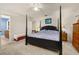 A main bedroom features a four-poster bed, and ceiling fan at 2817 Noble Crow Dr, Kissimmee, FL 34744