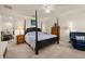 A main bedroom features a four-poster bed, ceiling fan, and an adjacent sitting area at 2817 Noble Crow Dr, Kissimmee, FL 34744