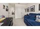 A versatile room featuring a comfortable sofa, desk, and ample closet space at 2817 Noble Crow Dr, Kissimmee, FL 34744