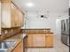 Stylish kitchen with granite countertops, tile backsplash, and a stainless steel dishwasher at 2900 E Grant Ave, Orlando, FL 32806