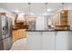 Updated kitchen with stainless steel appliances, granite counters, and ample cabinet space at 2900 E Grant Ave, Orlando, FL 32806
