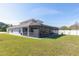 Expansive backyard featuring a screened-in patio, perfect for outdoor living and entertaining at 3006 Mandolin Dr, Kissimmee, FL 34744