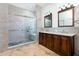 Modern bathroom with a glass shower, mosaic flooring, and stylish, and vanity at 3006 Mandolin Dr, Kissimmee, FL 34744