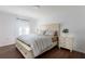 Bedroom with wood floors, Queen bed, bedside tables, and natural light at 3006 Mandolin Dr, Kissimmee, FL 34744