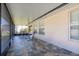 Spacious screened patio featuring slate tile, seating, and a hammock at 3006 Mandolin Dr, Kissimmee, FL 34744