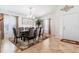 Elegant dining room featuring a stylish chandelier, a large dining table, and decorative accents at 3006 Mandolin Dr, Kissimmee, FL 34744