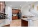 Open kitchen layout with wooden cabinets, stainless steel appliances, and granite countertops at 3006 Mandolin Dr, Kissimmee, FL 34744