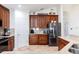Well-appointed kitchen with wooden cabinets, granite countertops, and stainless steel appliances at 3006 Mandolin Dr, Kissimmee, FL 34744