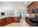 Bright kitchen with granite countertops, stainless steel appliances, and ample cabinet space at 3006 Mandolin Dr, Kissimmee, FL 34744