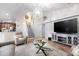 Open-concept living area with staircase and view to kitchen at 3006 Mandolin Dr, Kissimmee, FL 34744