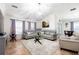 Bright living room with vaulted ceilings, a chandelier, and neutral decor at 3006 Mandolin Dr, Kissimmee, FL 34744