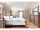 Spacious main bedroom with a decorative headboard, neutral decor, and ample natural light at 3006 Mandolin Dr, Kissimmee, FL 34744