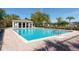 Community pool with ample deck space and a covered pavilion at 3006 Mandolin Dr, Kissimmee, FL 34744