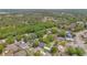 An aerial view of the neighborhood with lush trees and the property location at 344 Sandpiper Dr, Casselberry, FL 32707