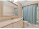 Bathroom featuring a vanity, a sink with a faucet, and a shower with a blue curtain for privacy at 344 Sandpiper Dr, Casselberry, FL 32707
