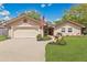 Charming single-story home with manicured lawn, garden, and American flag at 344 Sandpiper Dr, Casselberry, FL 32707