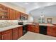 Bright kitchen features black appliances, light countertops, and warm wood cabinets at 344 Sandpiper Dr, Casselberry, FL 32707