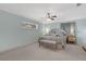Comfortable main bedroom with soft colors, carpet, ceiling fan, and natural light from the window at 344 Sandpiper Dr, Casselberry, FL 32707