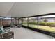 Screened patio with comfortable furniture, a concrete floor, and a view of the fenced backyard at 344 Sandpiper Dr, Casselberry, FL 32707