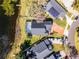 Top-down aerial showcasing a property with a screened-in pool, neat landscaping, and a charming neighborhood setting at 352 Misty Oaks Run, Casselberry, FL 32707