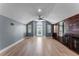 Large bonus room with vaulted ceilings, custom cabinets, and light wood floors, great for entertaining at 352 Misty Oaks Run, Casselberry, FL 32707
