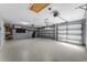 Spacious two-car garage with ample storage space and overhead lighting at 352 Misty Oaks Run, Casselberry, FL 32707