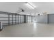 Spacious two car garage with modern doors, finished floors, and plenty of room for storage and vehicles at 352 Misty Oaks Run, Casselberry, FL 32707