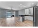 Kitchen with white cabinets, stainless appliances, and lake view at 352 Misty Oaks Run, Casselberry, FL 32707