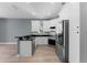 Bright kitchen with white cabinets and stainless steel appliances at 352 Misty Oaks Run, Casselberry, FL 32707
