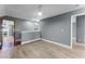 Open loft area with light wood floors, offering flexible space for living or entertaining at 352 Misty Oaks Run, Casselberry, FL 32707