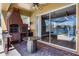 Outdoor patio features a built-in brick grill, granite table, and a view of the lake at 352 Misty Oaks Run, Casselberry, FL 32707