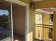 View from a balcony overlooking the building's facade, with open sliding glass door at 3714 Palm Desert Ln # 5337, Orlando, FL 32839