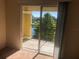 View from a balcony overlooking a scenic landscape with lush greenery and a serene body of water at 3714 Palm Desert Ln # 5337, Orlando, FL 32839