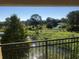 Scenic view from a balcony featuring lush greenery and a serene body of water under a clear sky at 3714 Palm Desert Ln # 5337, Orlando, FL 32839