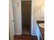 A bathroom featuring a convenient vanity area, alongside an open doorway to a closet at 3714 Palm Desert Ln # 5337, Orlando, FL 32839