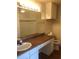 Bathroom with a large mirror and a white vanity offering ample counter and storage space at 3714 Palm Desert Ln # 5337, Orlando, FL 32839