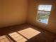 Bedroom with large windows and a scenic view, allowing ample natural light to illuminate the space at 3714 Palm Desert Ln # 5337, Orlando, FL 32839